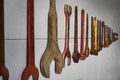 Vintage Tools Hung in Row on Wall