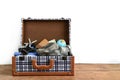 Vintage tourist luggage with clothes, accessories Royalty Free Stock Photo