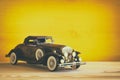 Vintage toy car over wooden table Royalty Free Stock Photo