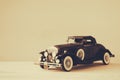 Vintage toy car over wooden table Royalty Free Stock Photo