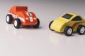 Vintage toy cars in a row on a white surface Royalty Free Stock Photo