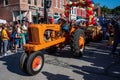 Vintage tractor in small town Applefest parade