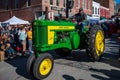 Vintage tractor in small town Applefest parade