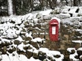 Vintage traditional red British post box in the snow Royalty Free Stock Photo