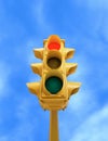 Vintage traffic light with red light on blue sky background Royalty Free Stock Photo