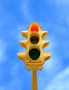 Vintage traffic light with red STOP light on blue sky background Royalty Free Stock Photo