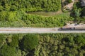 Vintage train driving on railway track in tropical forest at countryside Royalty Free Stock Photo