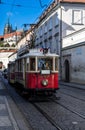 Vintage Tramway In Narrow Street In Front Of Hradcany Castle And Saint Vitus Cathedral In Prague In The Czech Republic