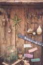 Vintage travel still life on old wooden fence with rope, starfish, compass, wooden signs and accessories