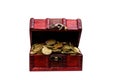 Vintage treasure chest full of golden coins isolated on white background Royalty Free Stock Photo