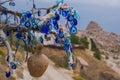 A vintage tree decorated with non-commercial Evil Eyes pots Cappadocia. Uchisar. Evil Eye is a Turkish traditional ornament dating