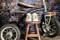 Vintage tricycle and baby shoes on red stool