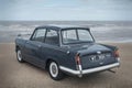 Vintage Triumph Herald by the sea