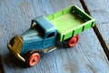 Vintage truck (lorry) toy on blue wooden background Royalty Free Stock Photo