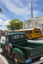 Vintage truck, yellow school bus and Tower Theatre in Little Havana, Miami, Florida