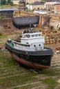 Tug boat under repair in dry dock Royalty Free Stock Photo