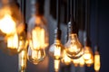 Diferent vintage tungsten filament lamps hanging from the ceiling Royalty Free Stock Photo