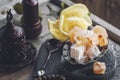 Vintage Turkish delight Cup with a Cup of tea. Oriental sweets on a wooden table. Beautiful still life for a Muslim holiday Royalty Free Stock Photo