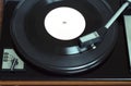 Vintage turntable with vinyl record top view closeup Royalty Free Stock Photo