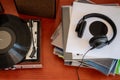 Vintage turntable with vinyls and headphones