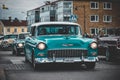 Vintage turquoise car during a cruising event