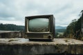 Vintage TV rests on a stone surface, a timeless entertainment relic