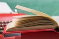 vintage typewriter and book close up on the table - writing or journalism concept Royalty Free Stock Photo