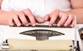 Vintage typewriter concept. Hands typing retro writing machine. Old typewriter and authors hands. Male hands type story Royalty Free Stock Photo