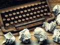 Vintage Typewriter covered desk paper balls closeup