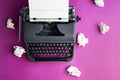 Vintage typewriter and crumpled paper sheets. Writer and blogger concept. Top view, flat lay Royalty Free Stock Photo