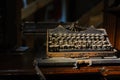 Vintage typewriter on the desk full of cobweb Royalty Free Stock Photo