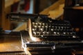 Vintage typewriter on the desk full of cobweb Royalty Free Stock Photo