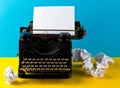 Vintage typewriter with empty, blank sheet of paper and crumbled Royalty Free Stock Photo