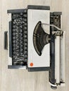 Vintage typewriter header with old paper. retro machine technology - top view and creative flat lay. Royalty Free Stock Photo