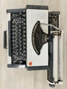 Vintage typewriter header with old paper. retro machine technology - top view and creative flat lay. Royalty Free Stock Photo