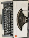 Vintage typewriter header with old paper. retro machine technology - top view and creative flat lay. Royalty Free Stock Photo