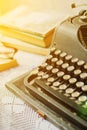 Vintage typewriter, old books on table Royalty Free Stock Photo