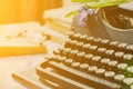 Vintage typewriter, old books on table Royalty Free Stock Photo