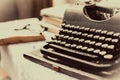 Vintage typewriter, old books on table Royalty Free Stock Photo