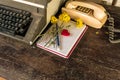 Vintage typewriter , old telephone , dry chrysanthemum flower and white paper note old wooden touch-up in still life concept Royalty Free Stock Photo