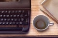 Vintage typewriter, pencil, paper and empty coffee cup Royalty Free Stock Photo