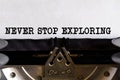 Vintage typewriter with printed text -NEVER STOP EXPLORING, on a sheet of paper
