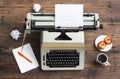 Vintage typewriter with a sheet of paper on an old desk Royalty Free Stock Photo