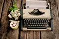 Vintage typewriter and telephone , notebook on the wood desk in Royalty Free Stock Photo