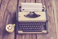 Vintage typewriter and telephone , notebook on the wood desk in Royalty Free Stock Photo