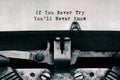 Vintage typewriter with text If you never try you\'ll never know Royalty Free Stock Photo