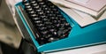 Vintage typewriter in turquoise color