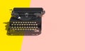 Vintage typewriter on two-tone background