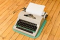 Vintage typewriter on a wooden floor Royalty Free Stock Photo