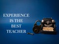 Vintage typewritter and padlock with the word EXPERIENCE IS THE BEST TEACHER Royalty Free Stock Photo